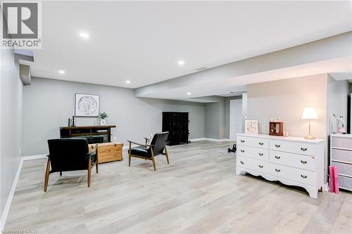 Spacious room featuring light wood-finish flooring, recessed lighting, and light grey wall tones - 7 Kinsman Drive, Binbrook, ON - Indoor