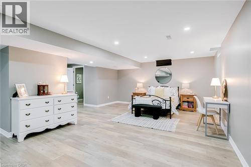 Spacious room featuring light wood-finish flooring, recessed lighting, and neutral wall tones - 7 Kinsman Drive, Binbrook, ON - Indoor