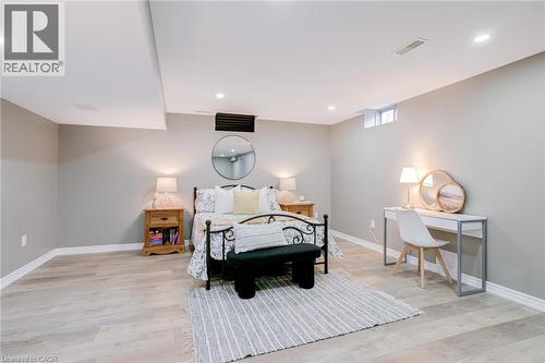 Bedroom featuring light wood-finish flooring, recessed lighting, and a neutral wall color - 7 Kinsman Drive, Binbrook, ON - Indoor Photo Showing Bedroom