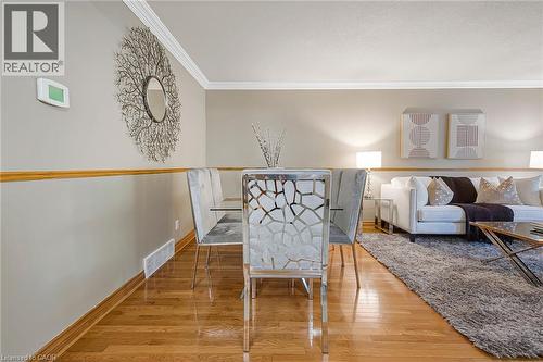 Hardwood-finish flooring extending from the foreground into the living area - 124 Dunsmere Drive, Kitchener, ON - Indoor Photo Showing Other Room
