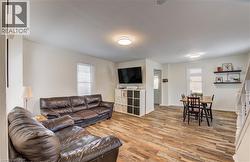 Open concept living area featuring wood-finish flooring - 