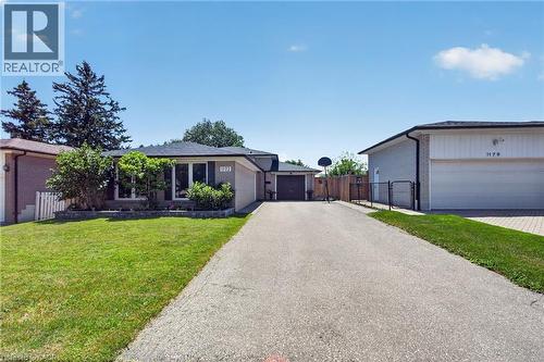 Ranch-style residence featuring a brick facade with a charcoal roof and white trim - 1172 Chada Avenue, Mississauga, ON - Outdoor