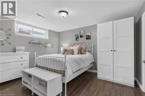 Bedroom featuring wood-finish flooring, a window with blinds, and light gray walls - 1172 Chada Avenue, Mississauga, ON - Indoor Photo Showing Bedroom