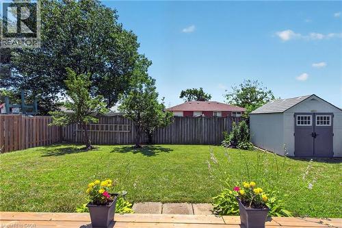 Expansive green lawn area featuring mature trees and a privacy fence - 1172 Chada Avenue, Mississauga, ON - Outdoor