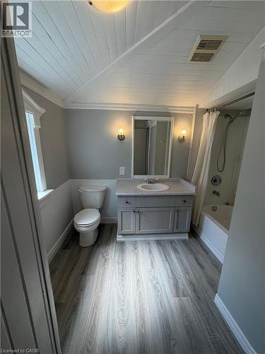Bathroom featuring wood-finish flooring and a sloped planked ceiling - 104 Marshall Street, Waterloo, ON - Indoor Photo Showing Bathroom