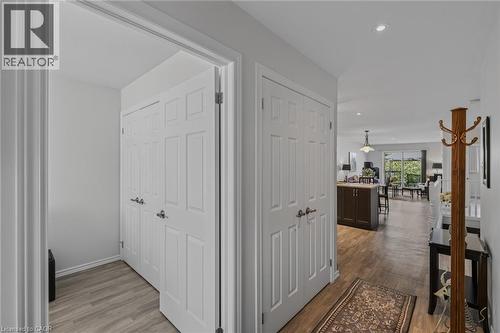 Hallway featuring wood-finish flooring, recessed lighting, and white paneled doors - 51 Millcroft Drive, Simcoe, ON - Indoor Photo Showing Other Room