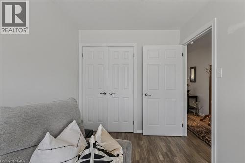 Light gray walls paired with wood-finish flooring - 51 Millcroft Drive, Simcoe, ON - Indoor