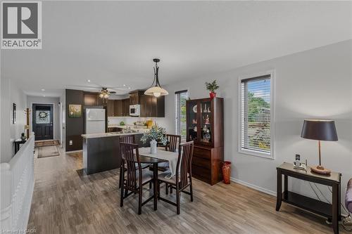 Open-concept main living area featuring wood-finish flooring throughout - 51 Millcroft Drive, Simcoe, ON - Indoor
