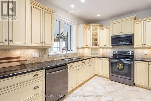 130 Concession 15 W, Tiny, ON - Indoor Photo Showing Kitchen With Double Sink