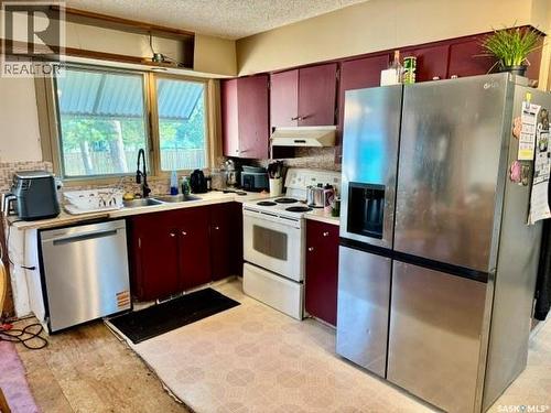 11 Vetshome Drive, Lanigan, SK - Indoor Photo Showing Kitchen With Double Sink