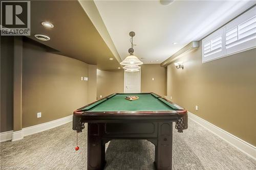 Spacious recreation room featuring a billiard table, recessed lighting, and wall sconces - 4278 Clubview Drive, Burlington, ON - Indoor Photo Showing Other Room