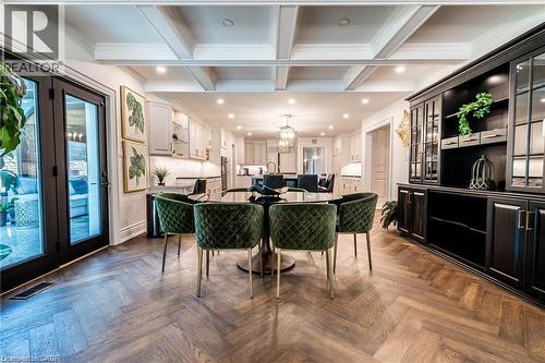 Expansive dining area featuring coffered ceilings and herringbone wood-finish flooring - 76 Adriatic Boulevard, Hamilton, ON - Indoor Photo Showing Other Room