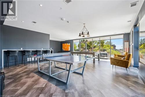 Expansive open-concept room featuring wood-finish flooring and floor-to-ceiling windows - 15 Glebe Street Unit# 902, Cambridge, ON - Indoor Photo Showing Other Room