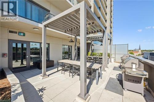 Expansive rooftop patio featuring multiple pergolas providing shaded outdoor areas - 15 Glebe Street Unit# 902, Cambridge, ON - Outdoor With Balcony