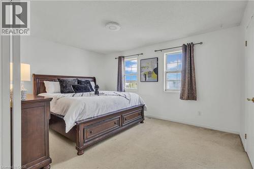 Carpeted room with white walls and a ceiling-mounted light fixture - 425 Erinbrook Drive, Kitchener, ON - Indoor Photo Showing Bedroom