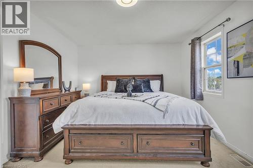 Spacious room featuring light-colored walls and a window with natural light - 425 Erinbrook Drive, Kitchener, ON - Indoor Photo Showing Bedroom