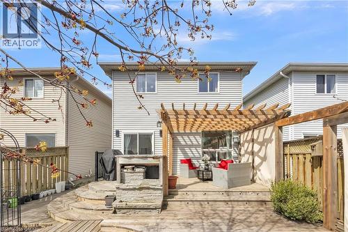 Multi-level wood deck featuring a pergola, privacy curtains, and a stone outdoor cooking station - 425 Erinbrook Drive, Kitchener, ON - Outdoor With Deck Patio Veranda With Exterior