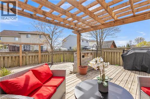 Wooden deck featuring a pergola, privacy fencing, and built-in wood-paneled counter - 425 Erinbrook Drive, Kitchener, ON - Outdoor With Deck Patio Veranda