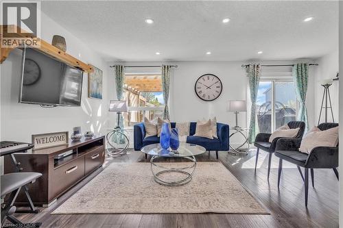Living area with wood-finish flooring, recessed lighting, and white walls - 425 Erinbrook Drive, Kitchener, ON - Indoor Photo Showing Living Room