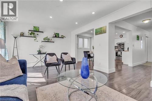 Spacious interior featuring wood-finish flooring, recessed lighting, and white baseboards - 425 Erinbrook Drive, Kitchener, ON - Indoor