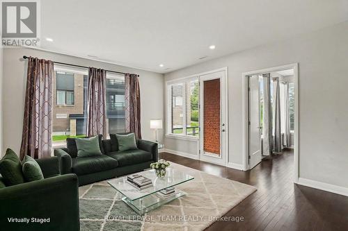 Virtually staged living room - 104 - 190 Boundstone Way, Ottawa, ON - Indoor Photo Showing Living Room