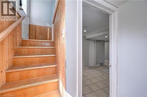Wood-panel staircase with matching handrail - 147 Courtland Avenue E, Kitchener, ON - Indoor Photo Showing Other Room