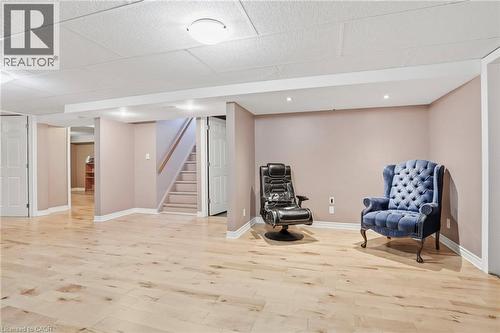 Spacious room featuring light wood-finish flooring, recessed lighting, and a drop ceiling - 25 Saveryn Road, Hamilton, ON - Indoor