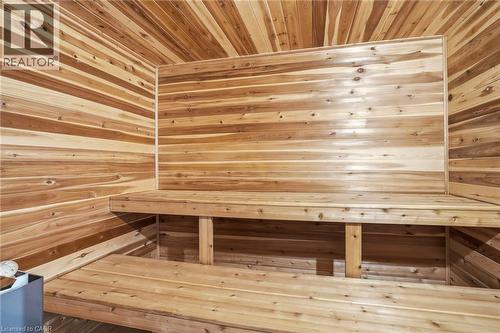 Custom wood-paneled sauna featuring a multi-tiered bench design - 25 Saveryn Road, Hamilton, ON - Indoor Photo Showing Other Room
