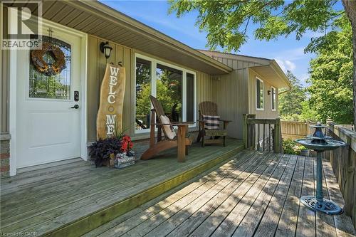 Expansive wood-finish deck with railing, offering multiple seating areas - 25 Saveryn Road, Hamilton, ON - Outdoor With Deck Patio Veranda With Exterior