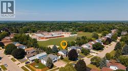 Residential neighborhood featuring detached homes and ample tree coverage - 