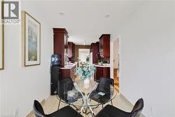 Dining area featuring light-toned tile flooring and recessed ceiling lighting - 