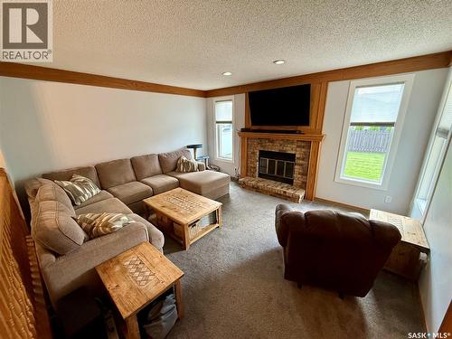 2746 Poplar Place E, Regina, SK - Indoor Photo Showing Living Room With Fireplace
