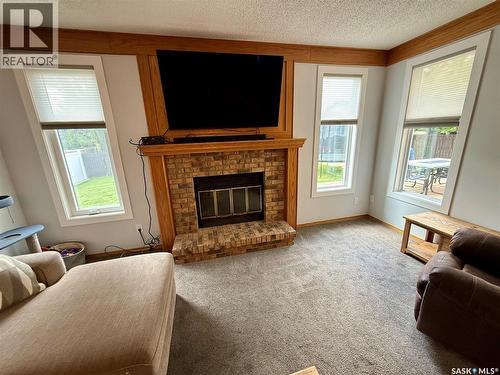 2746 Poplar Place E, Regina, SK - Indoor Photo Showing Living Room With Fireplace