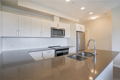 #608-2843 Jacklin Rd, Langford, BC - Indoor Photo Showing Kitchen With Stainless Steel Kitchen With Double Sink With Upgraded Kitchen