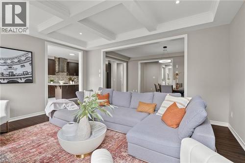Living area with coffered ceiling and dark wood-finish flooring - 96 Damselfly Way, Ottawa, ON - Indoor Photo Showing Living Room