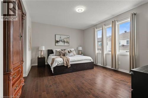 Spacious room featuring rich wood-finish flooring - 96 Damselfly Way, Ottawa, ON - Indoor Photo Showing Bedroom
