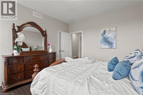 Spacious room featuring wood-finish flooring and light neutral wall tones - 96 Damselfly Way, Ottawa, ON - Indoor Photo Showing Bedroom