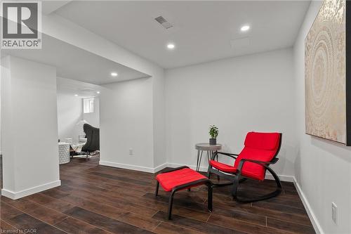Expansive room featuring wood-finish flooring, recessed lighting, and bright white walls - 96 Damselfly Way, Ottawa, ON - Indoor Photo Showing Other Room