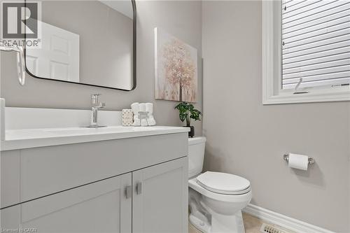 Modern vanity with a white countertop and sleek chrome faucet - 96 Damselfly Way, Ottawa, ON - Indoor Photo Showing Bathroom