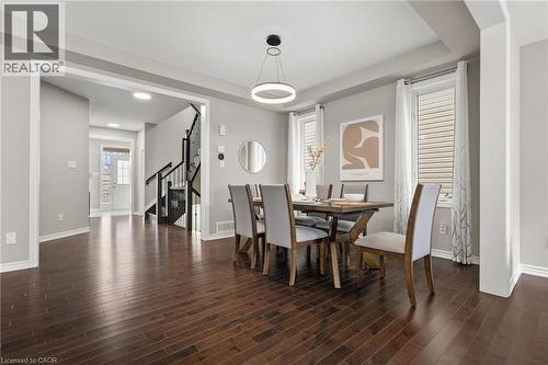 Formal dining area featuring rich wood-finish flooring - 96 Damselfly Way, Ottawa, ON - Indoor Photo Showing Dining Room