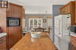 Kitchen island featuring a wood-finish countertop - 