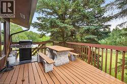 Spacious wood-finish deck with wood railing - 