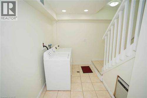 Dedicated laundry area featuring tile flooring and recessed lighting - 18 Heritage Drive, Guelph, ON - Indoor Photo Showing Laundry Room