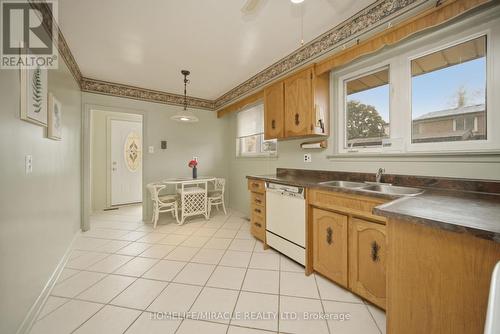 Eat-In Kitchen With Great Potential - 7089 Landen Court, Mississauga, ON - Indoor Photo Showing Kitchen With Double Sink