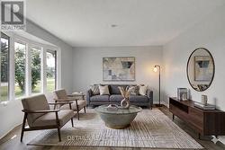 Virtually staged living rm on main floor. - 