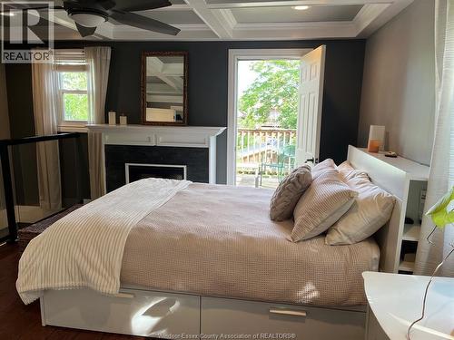 769 Assumption, Windsor, ON - Indoor Photo Showing Bedroom With Fireplace