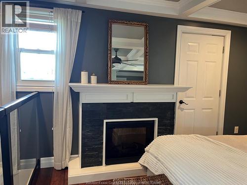 769 Assumption, Windsor, ON - Indoor Photo Showing Bedroom With Fireplace