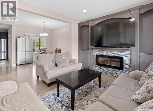 526 Maple Crescent, Warman, SK - Indoor Photo Showing Living Room With Fireplace