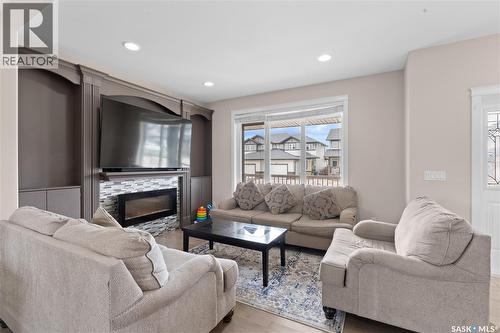 526 Maple Crescent, Warman, SK - Indoor Photo Showing Living Room With Fireplace