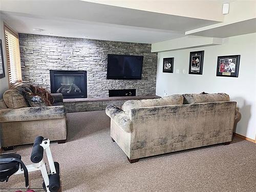 106 River Dr, Selkirk, MB - Indoor Photo Showing Living Room With Fireplace